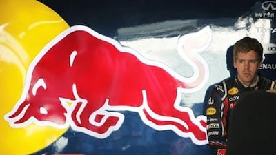 Sebastian Vettel sits in the Red Bull Racing team pit during yesterday’s practice at the Yas Marina Circuit in Abu Dhabi.