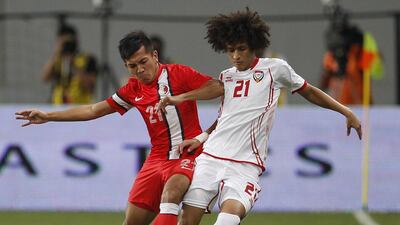 UAE’s Omar Abdulrahman, right, has impressed scouts in Europe and a step in a new direction for the footballer is highly possible this year. AFP
