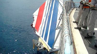 The Brazilian Navy picks a piece of debris from Air France flight AF447 out of the Atlantic Ocean in June 2009. Reuters