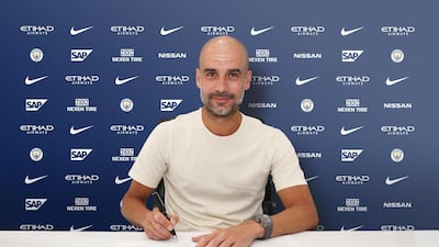 Pep Gaurdiola signs a two-year contract extension keeping him at Manchester City until 2021. Courtesy Manchester City