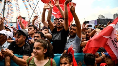 Supporters of the Turkish President shout slogans as they attend a campaign rally in Istanbul on June 23, 2018, one day before presidential and parliamentary elections. Turkey is preparing for tight presidential and parliamentary elections on June 24, while many analysts say the incumbent President wants a major foreign policy success to give him a final boost. / AFP / Aris MESSINIS