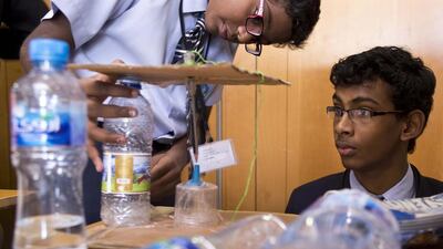 Emax Young Innovators 2013 at the Knowledge Village conference centre yesterday. Aswin Anish, left, and Amrith Krishnan from the JSS Private School, Dubai, show their gravity-powered merry-go-round. Antonie Robertson / The National