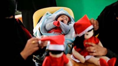 Artisans sew Christmas toys at Zeina Association and Cooperative for Handicraft in Beit Hanun in the northern Gaza Strip. AFP