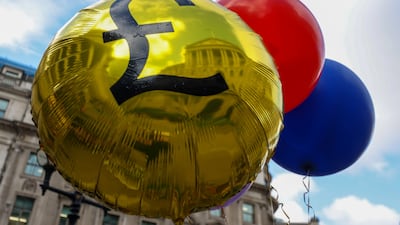 Balloons carried by demonstrators during a protest against the Bank of England's approach to fighting inflation. Bloomberg
