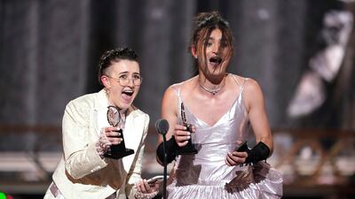 Lucy Moss, left, and Toby Marlow accept the award for Best Original Score for "SIX: The Musical". AP