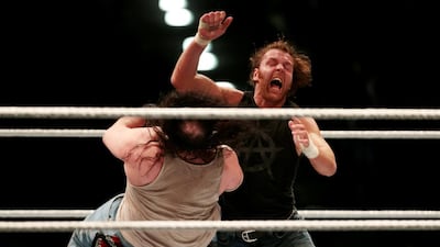 Dean Ambrose, right, in action in Abu Dhabi in February 2015. The Intercontinental champion is among the WWE Superstars coming to Dubai in April. Christopher Pike / The National
