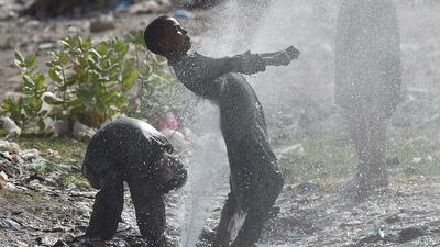 People cool off in water during a heatwave in Karachi, Pakistan. Temperatures could exceed 50°C in some parts of the country in late May/early June, according to forecasters. EPA