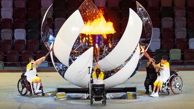 Handout photo dated 24/08/2021 provided by OIS of Torchbearers Yui Kamiji, Shunsuke Uchida and Karin Morisaki lighting the Paralympic flame during the opening ceremony of the Tokyo 2020 Paralympic Games at Olympic Stadium in Japan. Picture date: Tuesday August 24, 2021.