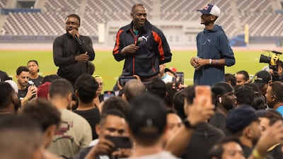 Usian Bolt, centre, meets fans in Doha. Photo: PUMA