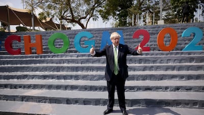 Britain's Prime Minister Boris Johnson poses as he attends a Commonwealth Business Forum Exhibition at The Kigali Cultural Village, during the Commonwealth Heads of Government Meeting. AFP