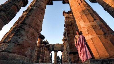 An actress in costume poses next to a column during the filming of a television production at the Temple of Zeus in the ruins of Libya's eastern city of Cyrene. The remains of the ancient Greek city survived Libya's 2011 revolution and a decade of lawlessness. Today, they face new threats: plunder and bulldozers. Unesco added Cyrene to its World Heritage List in 1992. AFP