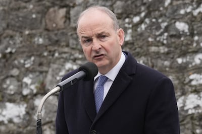 Simon Harris will face Fianna Fáil's Micheal Martin, above, in the election on November 29. PA