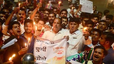 Indian Congress workers participate in a candle light procession as they shout slogans against Indian Prime Minister Narendra Modi during a protest against rape incidents, in Allahabad. Sanjay Kanojia / AFP / April 13, 2018