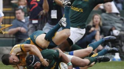 Timana Tahu, left, fails to stop South Africa's Adrian Jacobs going over to score a try against Australia in their Tri-Nations rugby union clash in Durban August 23, 2008.