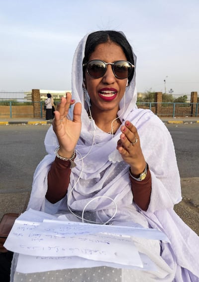 Alaa Salah, a Sudanese woman propelled to internet fame earlier this week after clips went viral of her leading powerful protest chants against President Bashir. AFP