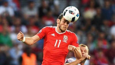 Gareth Bale of Wales and Denis Glushakov of Russia compete for the ball during the UEFA EURO 2016 Group B match between Russia and Wales at Stadium Municipal on June 20, 2016 in Toulouse, France. (Photo by Dennis Grombkowski/Getty Images)