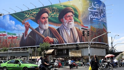 A billboard in Tehran depicting the late supreme leaders Ayatollah Ruhollah Khomeini and Ayatollah Ali Khamenei. EPA
