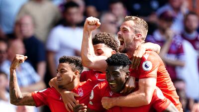 Awoniyi celebrates scoring with teammates. PA