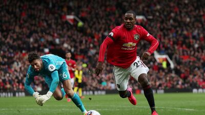 Manchester United's Odion Ighalo takes on Watford's Ben Foster. Reuters
