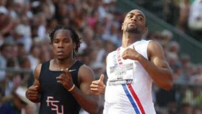 Tyson Gay, right, set a new national best in the 100 metres at the American Olympic Trials, but suffered a hamstring injury in the 200 metres.