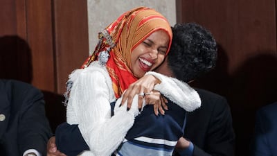 Democratic Representative Ilhan Omar (L) reacts after taking the oath of office from Speaker of the House Nancy Pelosi during the opening session of the 116th Congress in the US Capitol. EPA