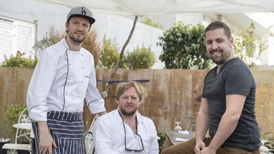 "It’s based on my studio in the Scottish highlands,” says Jonathan Gent, the British artist known for his abstract expressionism who started the cafe. From left, head chef Aaron Jones, co-founder Jonathan Gent and general manager Michael Daniell. Antonie Robertson/The National