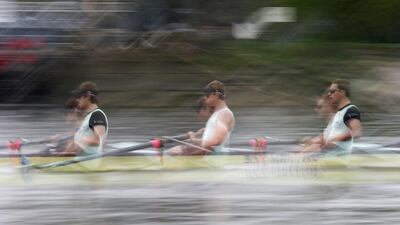 The Cambridge University rowing crew trains on the River Thames in London on Wednesday. The rowing crews from Oxford and Cambridge will compete in the 160th Boat Race between the two universities on Sunday. Suzanne Parker / Reuters / April 2, 2014