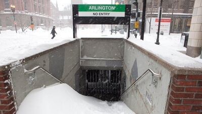 Snow piles up at the entrance of a closed subway station during the blizzard on January 27, 2015. All public transportation was shut down for the day. Kayana Szymczak/Getty Images/AFP