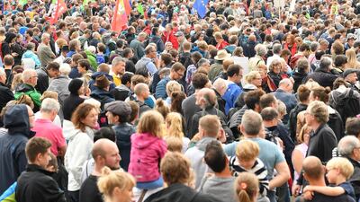 Demonstrators protest against the anti-migration policies of Angela Merkel's Bavarian sister party. Getty Images