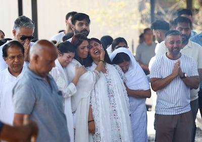 Aayushi Harpalani Udhwani, wife of Niraj Udhwani, who was killed in the attack near Pahalgam, is consoled by relatives during her husband's funeral in Jaipur, India on Thursday. Reuters