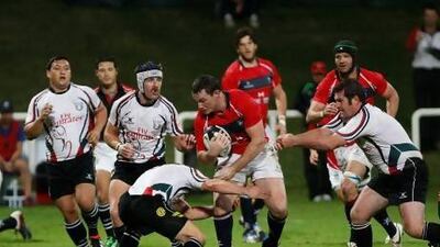 Hong Kong, in red, defeated the UAE side 51-6 on Tuesday at The Sevens stadium. Mike Young / The National