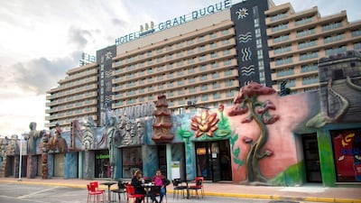 Tourists sit on a terrace in the Marina d’Or holiday resort. David Ramos / Getty Images
