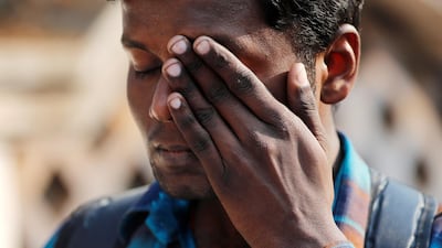 A fan reacts during the funeral procession. Danish Siddiqui / Reuters