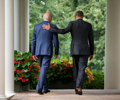 Then President Barack Obama walks with his Vice President at the time, Joe Biden, to the Oval Office of the White House in 2015. AP