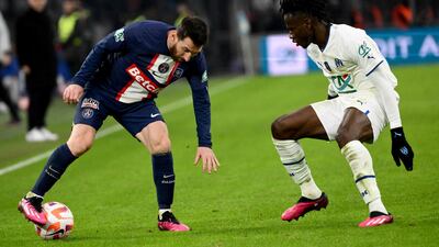 Paris Saint-Germain's forward Lionel Messi fights for the ball with Marseille's defender Issa Kabore. AFP
