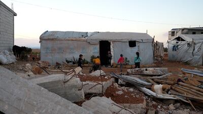 Like many returnees, some of Al Salloumieh's residents have chosen to live in tents until they can afford to rebuild. Ahmad Fallaha/The National