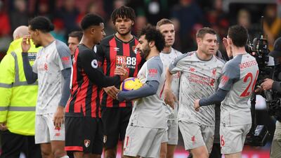 Lys Mousset of AFC Bournemouth shakes hands with Mohamed Salah. Getty Images