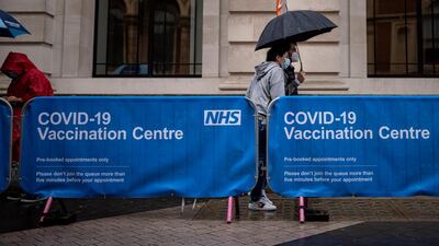 People queue for Covid-19 vaccines in London. A rise in new UK cases throws into question plans to further lift lockdown measures in mid-June. Getty Images