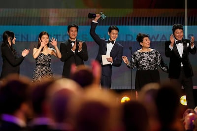 The cast of 'Parasite' accepts the award for outstanding performance by a cast in a motion picture. Reuters