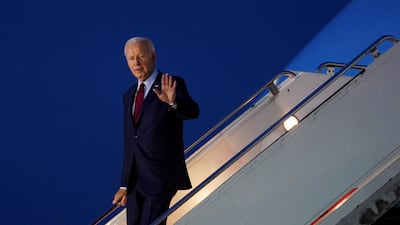 Mr Biden leaves his plane at Stansted. Reuters