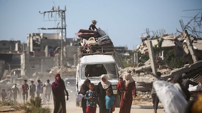 Displaced Palestinians, vehicles piled high with belongings, return to their homes to the north of Nuseirat refugee camp in central Gaza as the Israel-Hamas ceasefire holds. AFP