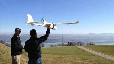 Conservation drone pioneer Lian Pin Koh, right, of the Swiss Federal Institute of Technology, and colleague Serge Wich conduct a drone test flight in Zurich, Switzerland.