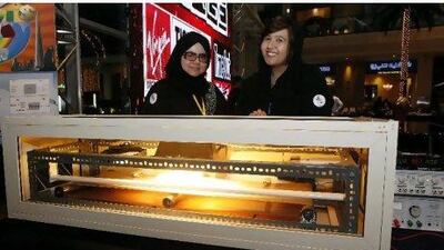 Wafa Abdallah, 22, left, and Nawal Yousif, 21, both from Sharjah Women's College with their invention, a home recycling device, at the Youth Talent Festival.