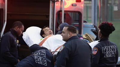Emergency personnel carry a man into an ambulance after a motorist drove onto a busy bicycle path near the World Trade Center memorial and struck several people Tuesday, Oct. 31, 2017, in New York. (AP Photo/Mark Lennihan)