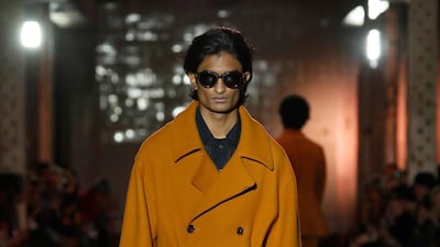 A decadent mustard trench coat walks at the Qasimi show during London Fashion Week Men’s Autumn/Winter 2020. Getty