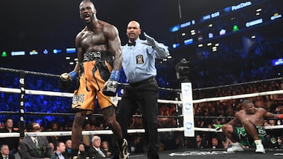 Deontay Wilder, left, secured a stoppage win against Luis Ortiz in New York on Saturday night. Timothy A Clary / AFP