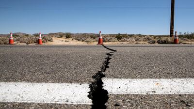 A cone indicates the localisation of a crack in the road after an earthquake near Ridgecrest shook Southern California, USA, 4 July 2019. EPA/ETIENNE LAURENT
