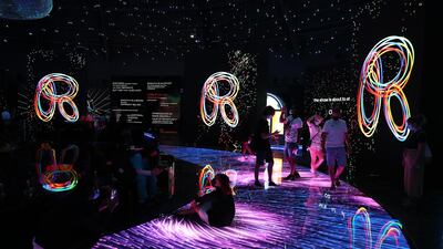 Visitors watching the audio visual show at the Russia pavilion. Pawan Singh/The National.