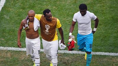 Anre Ayew, Michael Esien and Fatawu Dauda of Ghana leave the pitch after their 2-1 loss to Portugal on Thursday at the 2014 World Cup. Christopher Lee / Getty Images / June 26, 2014