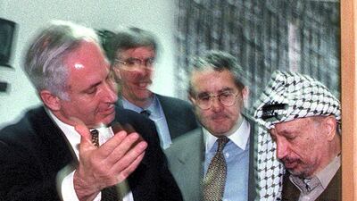 Palestinian president Yasser Arafat and Israeli Prime Minister Benjamin Netanyahu both gesture for the other to leave a meeting December 24 1996 in the Israeli Civil Administration headquarters located along the Israeli - Gaza Strip border area. The two leaders met for for over three hours in a bid to clinch the agreement on the long-delayed Israeli troop redeployment in Hebron. Although no agreement was reached US envoy Dennis Ross said that "real progress" was made towards the long-elusive accord. Reuters